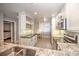 Modern kitchen with granite countertops and breakfast bar at 13313 Gasparilla Rd # 402, Placida, FL 33946