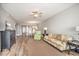 Living room with sofa, view to dining area and kitchen at 13313 Gasparilla Rd # 402, Placida, FL 33946