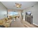 Living room with sofa, view of balcony and water views at 13313 Gasparilla Rd # 402, Placida, FL 33946