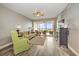 Living room with wood floors, comfy seating and water views at 13313 Gasparilla Rd # 402, Placida, FL 33946