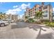 Parking lot with ample spaces and nearby building at 13313 Gasparilla Rd # 402, Placida, FL 33946