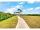 Landscaped grounds with gazebo and walkway at 13313 Gasparilla Rd # 402, Placida, FL 33946