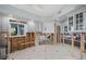 Partially renovated kitchen featuring white cabinets, tile floors, and a window view at 208 Driftwood Ln, Largo, FL 33770