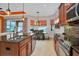 Modern kitchen with stainless steel appliances and a large island at 1647 Emerald Dunes Dr, Sun City Center, FL 33573