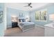 Light and airy bedroom with a queen bed, window seat, and updated fixtures at 200 Soliera St, Nokomis, FL 34275