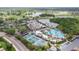 Aerial view of community amenities including pool, tennis and pickleball courts at 2226 Sifield Greens Way # 26, Sun City Center, FL 33573