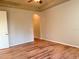 Spacious bedroom with wood-look floors and neutral walls at 2226 Sifield Greens Way # 26, Sun City Center, FL 33573