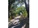 Walking bridge over canal with lush green vegetation at 2226 Sifield Greens Way # 26, Sun City Center, FL 33573