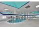 Indoor pool with a unique architectural design, perfect for year round swimming at 2226 Sifield Greens Way # 26, Sun City Center, FL 33573