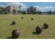 Community lawn bowling area with resident playing at 2226 Sifield Greens Way # 26, Sun City Center, FL 33573