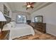 Spacious main bedroom with large bed, dresser, and ceiling fan at 2226 Sifield Greens Way # 26, Sun City Center, FL 33573