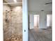 Bathroom featuring walk-in shower and access to bedroom at 3915 W San Pedro St, Tampa, FL 33629