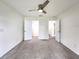 Bedroom with carpet floors, ceiling fan, and dual closets at 3915 W San Pedro St, Tampa, FL 33629