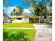 Charming single-story home with a well-manicured lawn, covered porch, and inviting curb appeal at 3915 W San Pedro St, Tampa, FL 33629