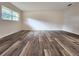 Spacious living room featuring durable laminate flooring and plenty of natural light at 3915 W San Pedro St, Tampa, FL 33629