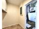 Utility room with storage cabinet and access to the backyard at 3915 W San Pedro St, Tampa, FL 33629