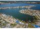 Aerial view of canal-front home with private dock and boat at 14035 E Parsley Dr, Madeira Beach, FL 33708