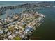 Wide aerial showcasing home's waterfront location in a community at 14035 E Parsley Dr, Madeira Beach, FL 33708