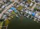 Aerial view of property highlighting its waterfront access and dock at 14035 E Parsley Dr, Madeira Beach, FL 33708