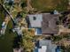 Aerial view of waterfront home with private dock and boat at 14035 E Parsley Dr, Madeira Beach, FL 33708