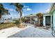 Backyard with screened patio and waterfront access at 14035 E Parsley Dr, Madeira Beach, FL 33708