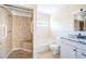 Bathroom with shower, tub, and granite countertop at 14035 E Parsley Dr, Madeira Beach, FL 33708