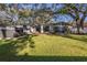 Large backyard with hot tub and spacious lawn at 2227 Willowbrook Dr, Clearwater, FL 33764