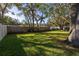 Large backyard with mature trees and grass at 2227 Willowbrook Dr, Clearwater, FL 33764