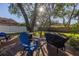 Spacious backyard with deck, grill, and lush lawn at 2227 Willowbrook Dr, Clearwater, FL 33764