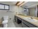 Bathroom with dual sinks and shower/tub combo at 2227 Willowbrook Dr, Clearwater, FL 33764