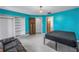 Bedroom with teal walls, built in shelves, and a bed at 2227 Willowbrook Dr, Clearwater, FL 33764