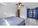 Spacious bedroom with ceiling fan and access to balcony at 2227 Willowbrook Dr, Clearwater, FL 33764