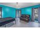 Bedroom with teal walls, a bed, and a recliner at 2227 Willowbrook Dr, Clearwater, FL 33764