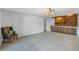 Dining room with wood shelving and a leather chair at 2227 Willowbrook Dr, Clearwater, FL 33764