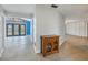 Bright hallway with wood cabinet and view to backyard at 2227 Willowbrook Dr, Clearwater, FL 33764