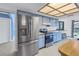 Stainless steel appliances and light blue kitchen cabinets at 2227 Willowbrook Dr, Clearwater, FL 33764