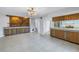 Retro kitchen with wood cabinets and a light blue backsplash at 2227 Willowbrook Dr, Clearwater, FL 33764