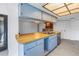 Kitchen with light blue cabinets and a butcher block island at 2227 Willowbrook Dr, Clearwater, FL 33764