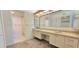 Spacious bathroom with double sinks and a separate shower and tub at 3076 Eastland Blvd # 106, Clearwater, FL 33761