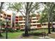 Condo building with landscaping and a park-like setting at 3076 Eastland Blvd # 106, Clearwater, FL 33761