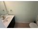 Small bathroom with a sink, toilet and mirror at 3336 Bellericay Ln, Land O Lakes, FL 34638