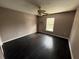 Bedroom with dark hardwood floors and ceiling fan at 3336 Bellericay Ln, Land O Lakes, FL 34638