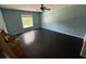 Bedroom with dark hardwood floors and ceiling fan at 3336 Bellericay Ln, Land O Lakes, FL 34638