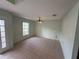 Simple dining room with tile floors and a window at 3336 Bellericay Ln, Land O Lakes, FL 34638