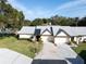 Aerial view of the house, showing its roof and landscaping at 3499 Cedar Ln, Palm Harbor, FL 34684