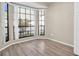 Bright dining area with large windows and wood floors at 3499 Cedar Ln, Palm Harbor, FL 34684