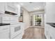 Modern kitchen with white cabinets and granite countertops at 3499 Cedar Ln, Palm Harbor, FL 34684