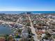 Aerial view of the home near the beach and waterway at 7060 Boca Ciega Dr, St Pete Beach, FL 33706