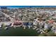 Aerial view of property near water, showing surrounding homes at 7060 Boca Ciega Dr, St Pete Beach, FL 33706