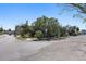 Residential street view showing a corner lot at 7060 Boca Ciega Dr, St Pete Beach, FL 33706